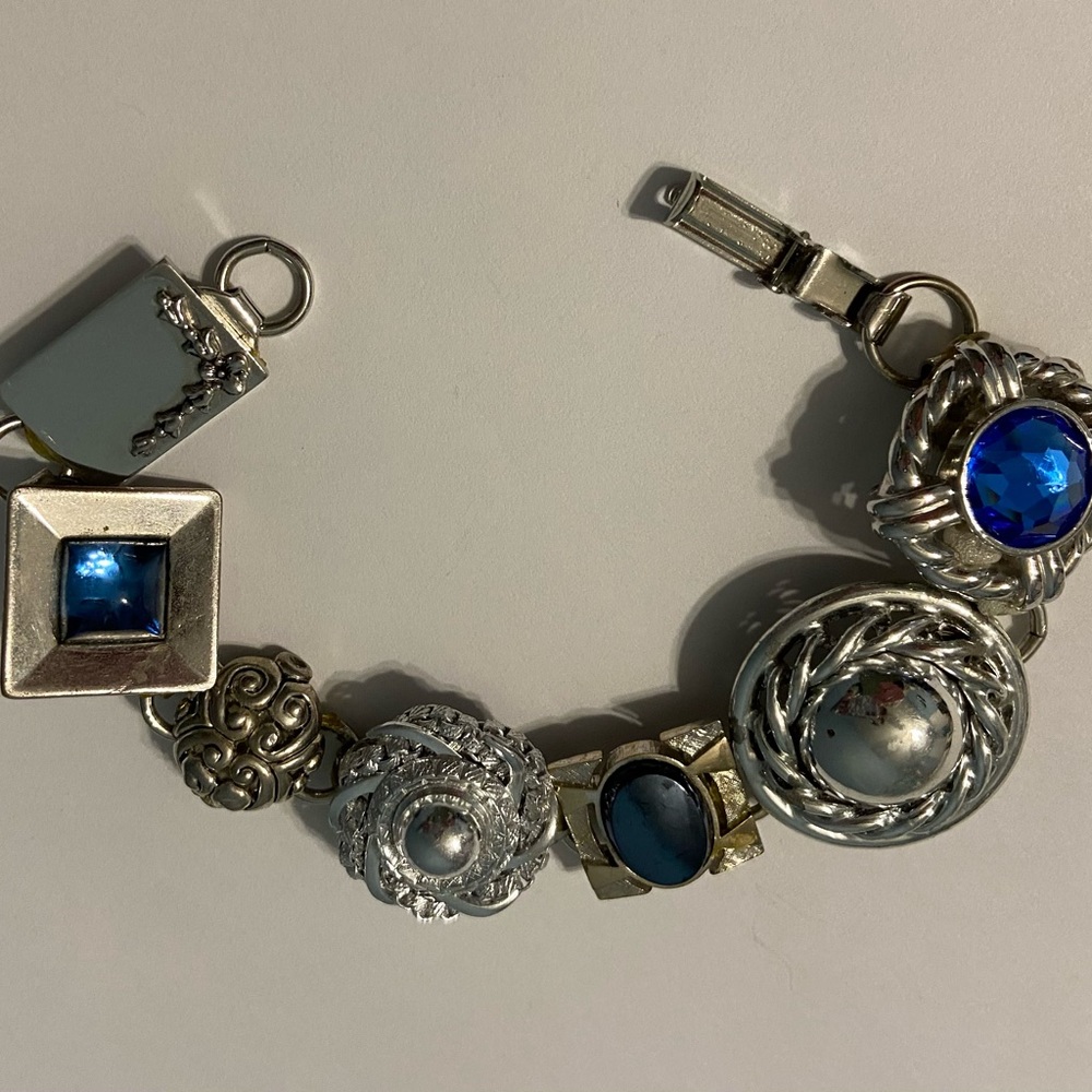 One of a kind bracelet made with vintage earrings and cuff links.